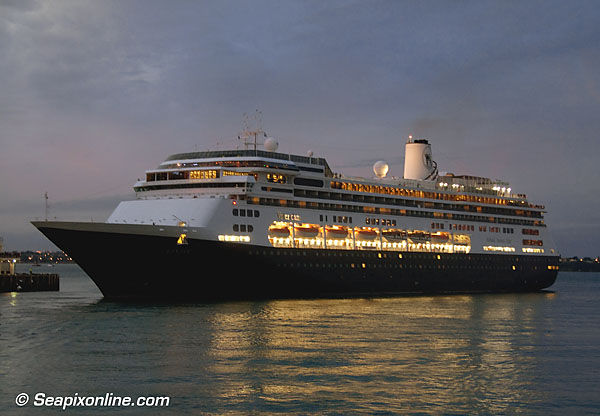 VOLENDAM (1999/61214grt/IMO 9156515) sails at dusk from Auckland, New Zealand. She followed P&O UK's ARCADIA and Regent Seven Seas' SEVEN SEAS VOYAGER out of port after one of the busiest days seen at the Auckland for some time. 9 February 2011. Photo by SeapixOnline.com/Trevor Coppock